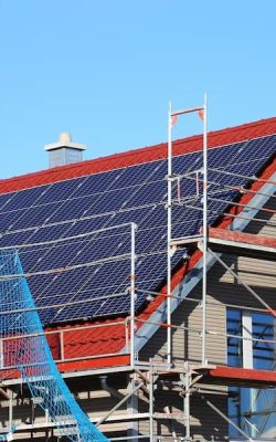 Home with solar panels and scaffolding