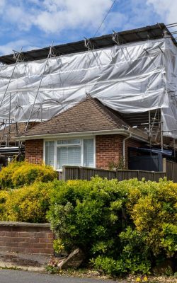 Domestic home with weather protection and temporary roofing scaffolding