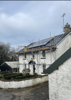 Domestic home with scaffolding for roof access